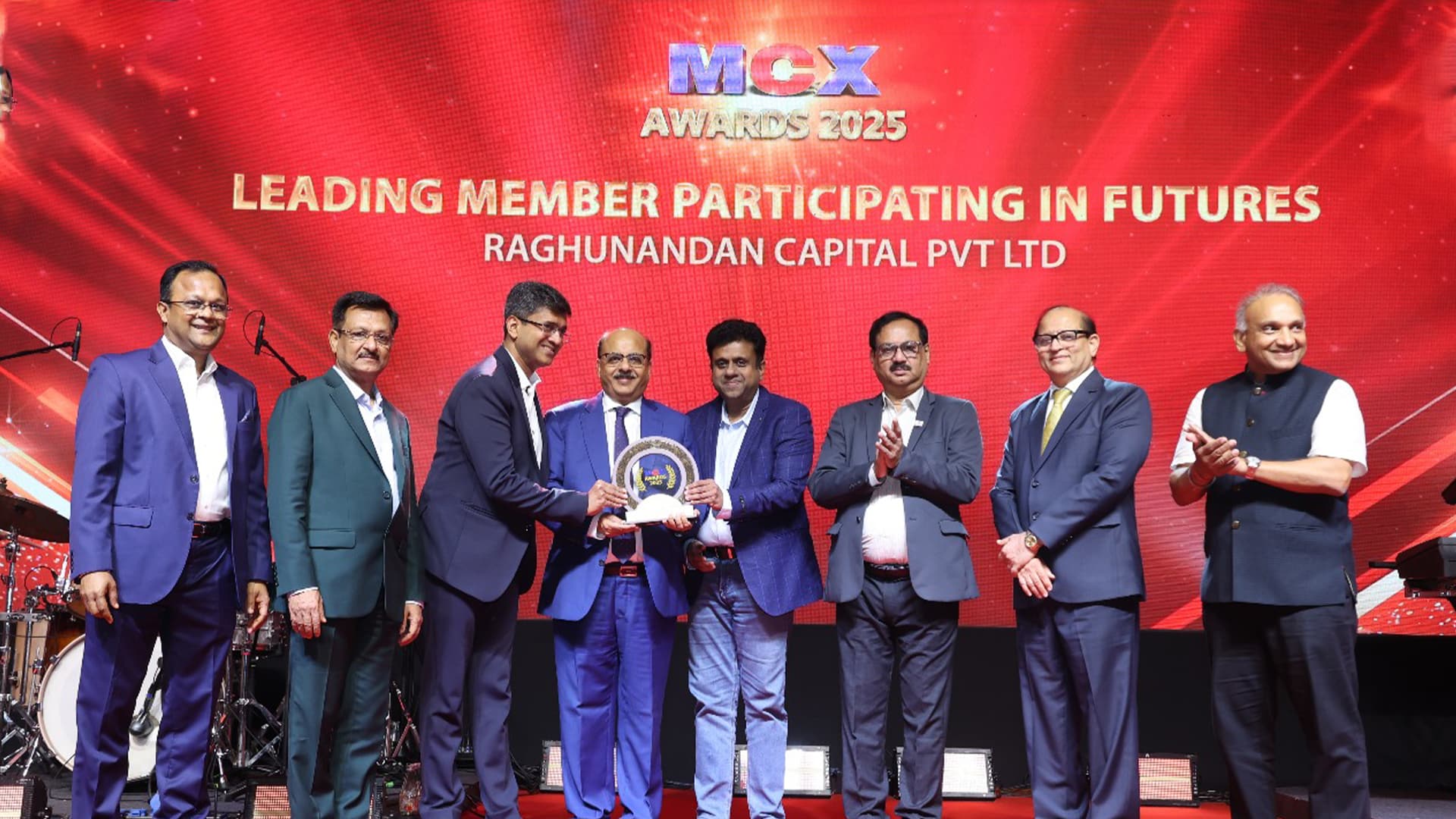 MCX Awards 2025 – Raghunandan Capital Pvt Ltd Honoured as Leading Member in Futures Raghunandan Capital Pvt Ltd receiving the MCX Awards 2025 for Leading Member Participating in Futures, on stage with dignitaries and team members